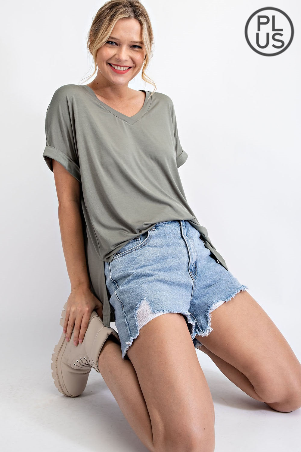Plus-size V-neck short sleeve Rae Mode top in Latte color
Close-up of back pleat detail and fabric texture
Vintage Denim variant of Rae Mode V-neck plus top, styled with jeans