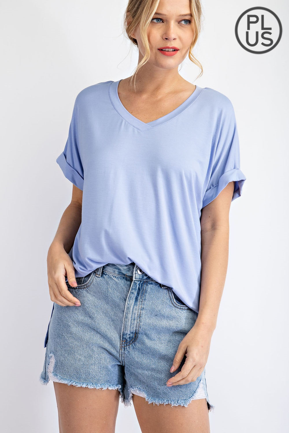 Plus-size V-neck short sleeve Rae Mode top in Latte color
Close-up of back pleat detail and fabric texture
Vintage Denim variant of Rae Mode V-neck plus top, styled with jeans
