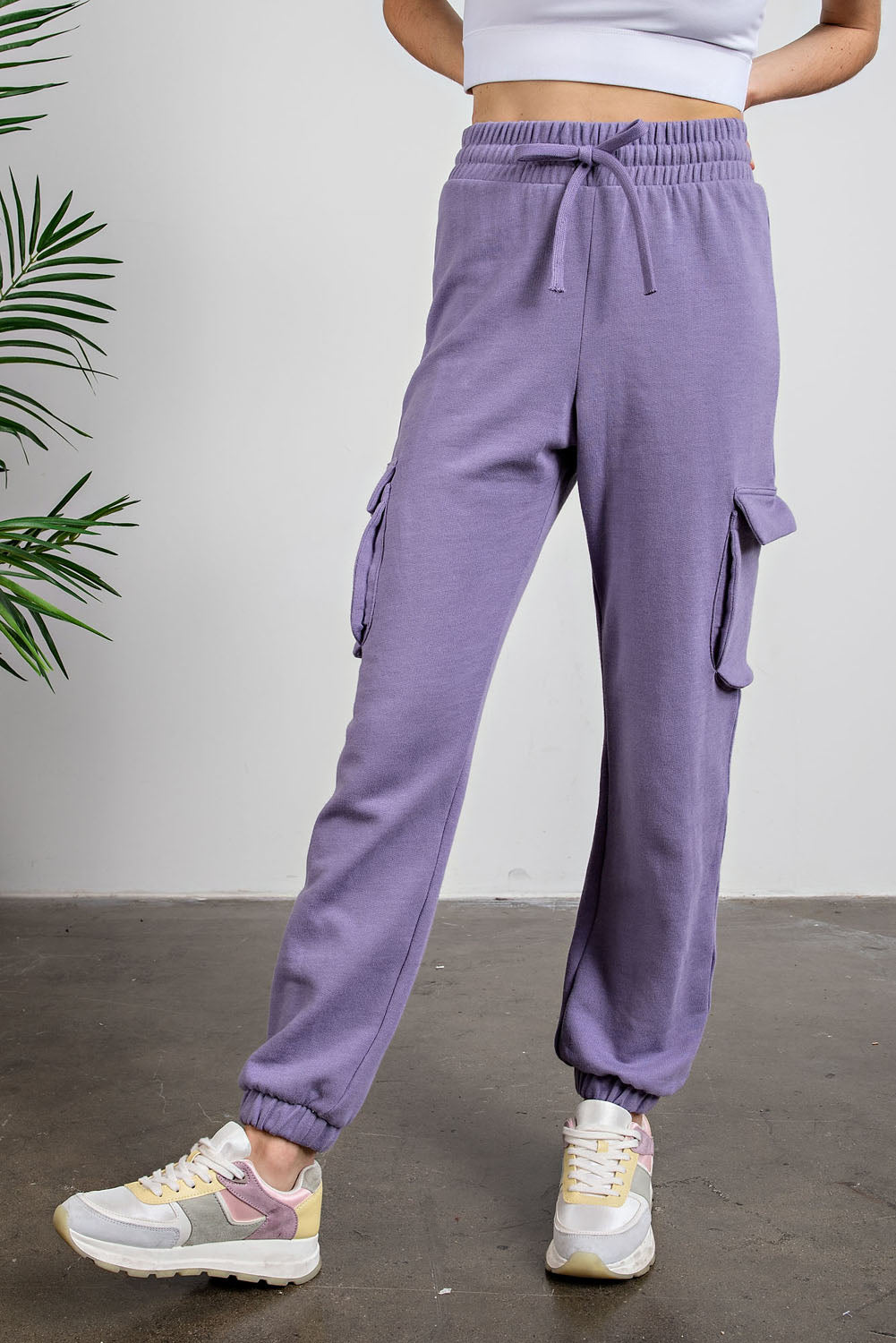 “Rae Mode cotton poly fleece cargo jogger pants in mauve/full visibility of side cargo pockets”
“Close-up of fleece texture and drawstring waistband”
“Jogger bottom banded hem and relaxed leg fit”