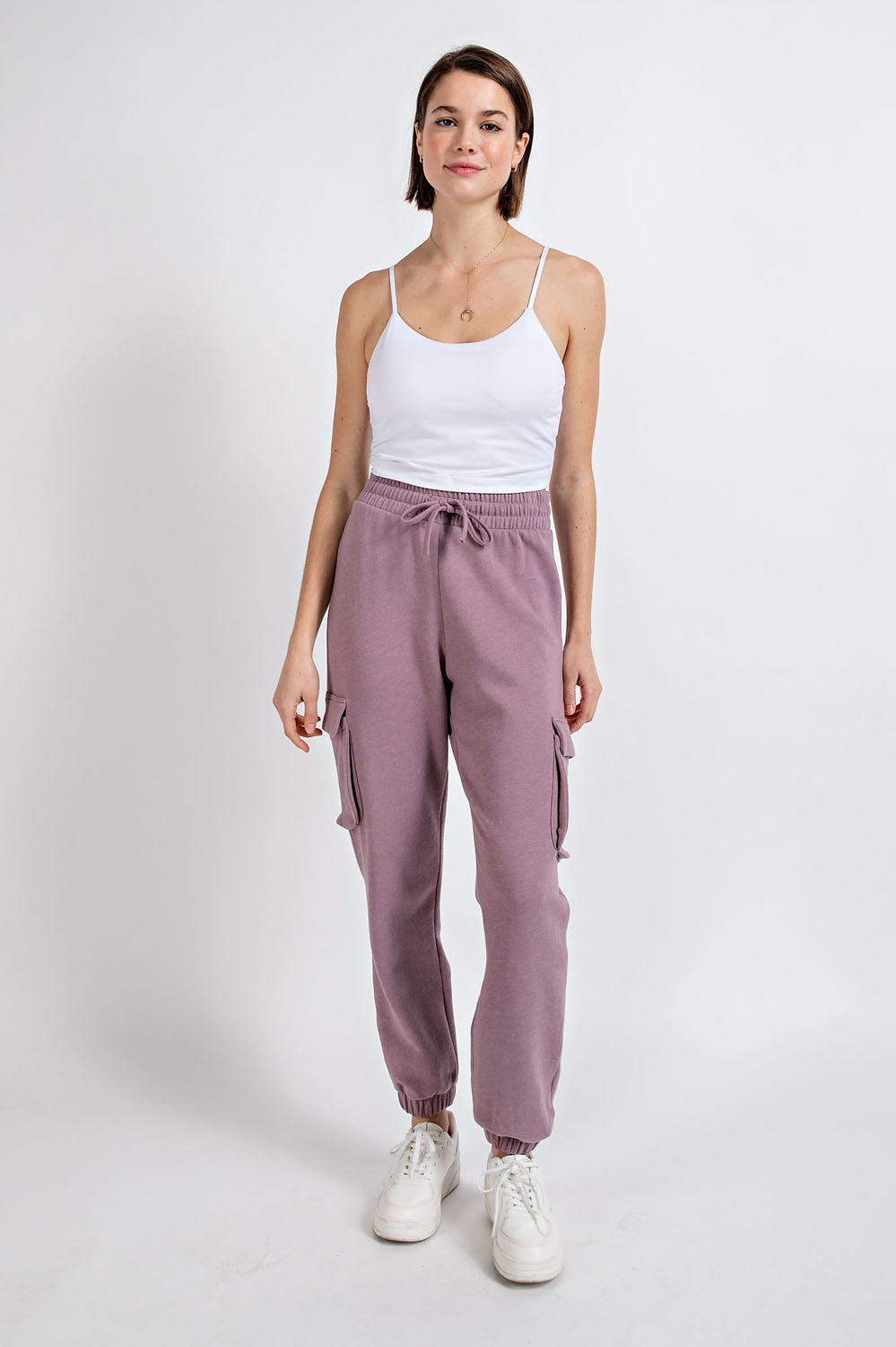 “Rae Mode cotton poly fleece cargo jogger pants in mauve/full visibility of side cargo pockets”
“Close-up of fleece texture and drawstring waistband”
“Jogger bottom banded hem and relaxed leg fit”