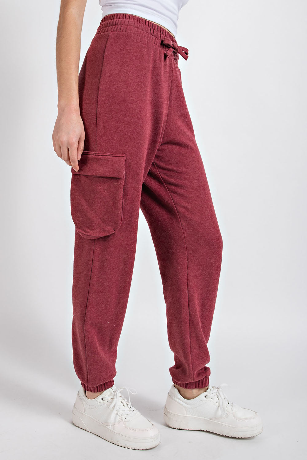 “Rae Mode cotton poly fleece cargo jogger pants in mauve/full visibility of side cargo pockets”
“Close-up of fleece texture and drawstring waistband”
“Jogger bottom banded hem and relaxed leg fit”