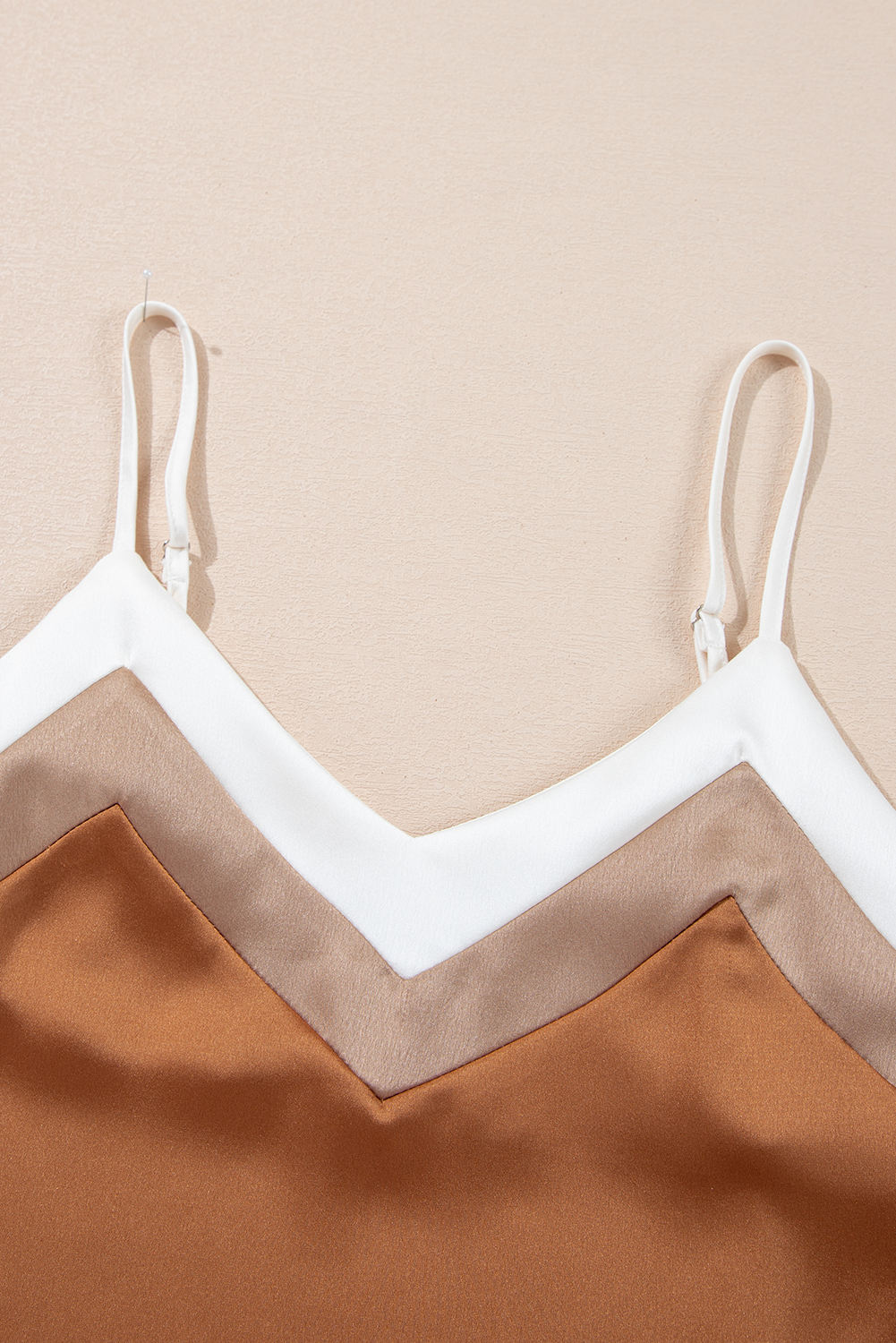 The Golden V Tank front view
The Golden V Tank back view
The Golden V Tank styled outfit
The Golden V Tank fabric detail close-up
The Golden V Tank flat lay display