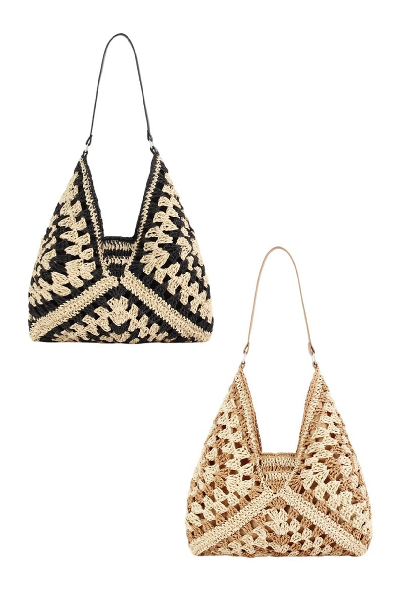 Vintage woven straw crochet bucket shoulder bag in natural straw tones
Close-up of crochet straw texture and shoulder strap detail
Bucket bag styled cross-body over floral dress or casual outfit