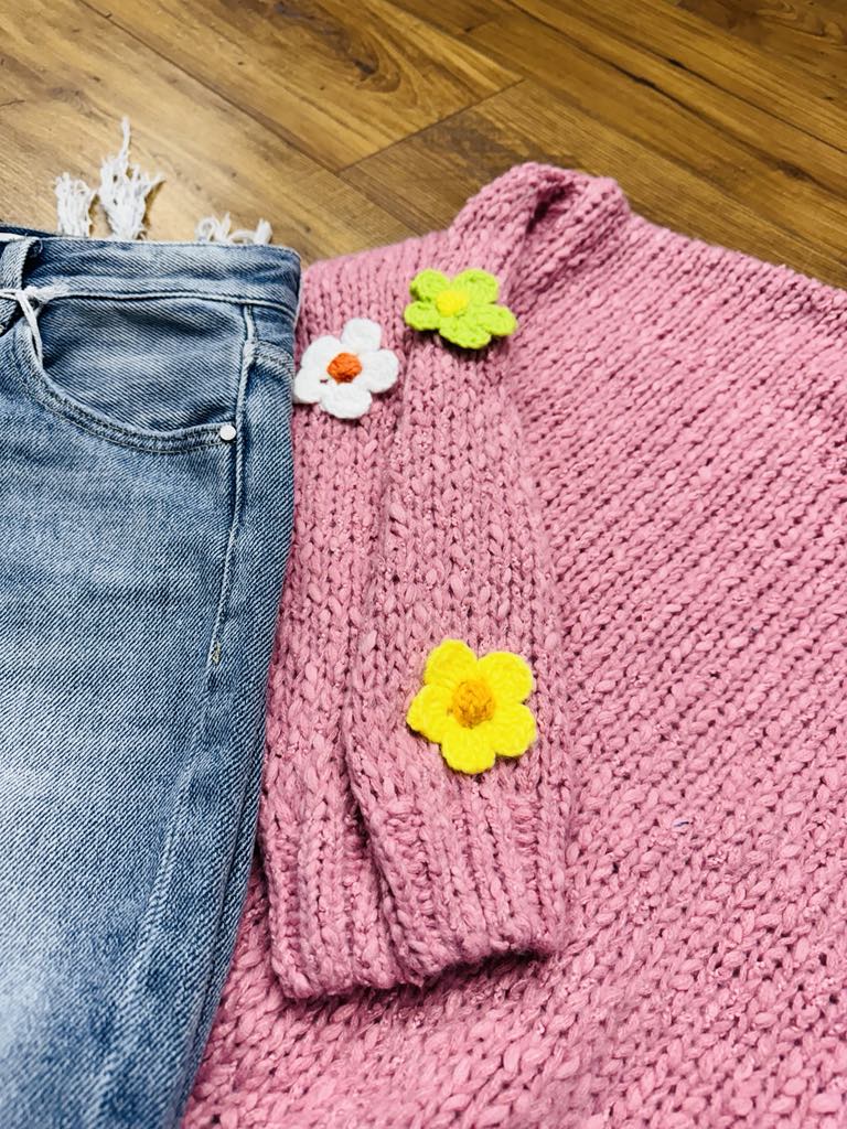 “Easel ‘Flower You Up’ cotton sweater with floral patches”
“Relaxed-fit knit sweater with dropped shoulders and flower details”
“Short sleeve floral-patch pullover—spring-ready style”