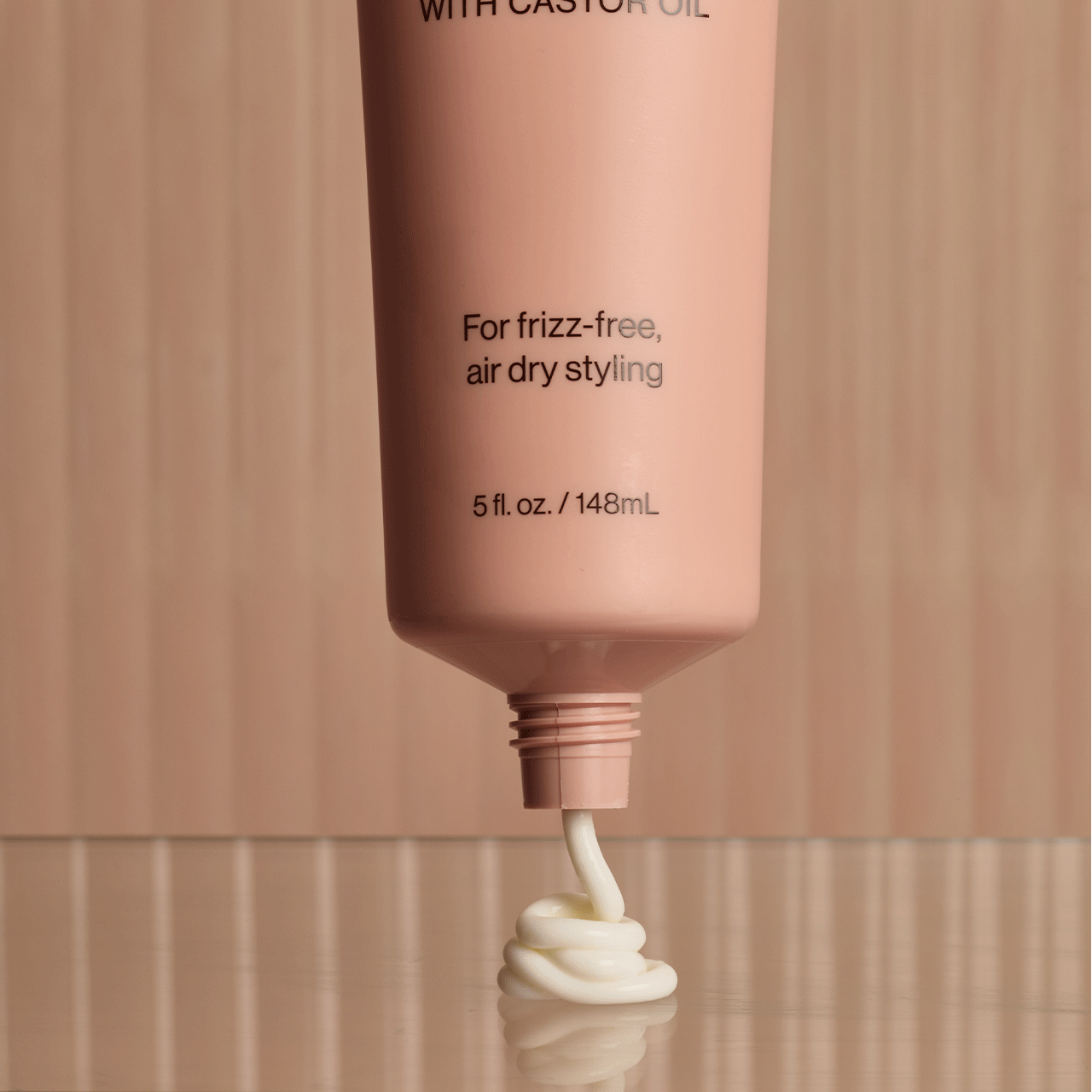 Lifestyle image of KITSCH Smoothing Air Dry Cream next to hairbrush and accessories