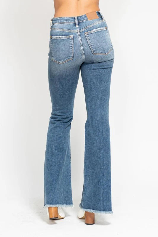 “Judy Blue mid rise flare jeans with button fly front”
“Stretch denim flare jeans with curve-friendly fit”
“Flare jeans styled with boots showing leg lengthening silhouette”