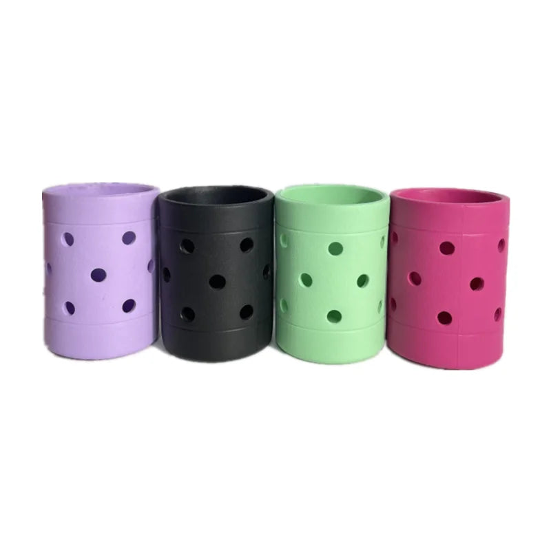 A collection of Bog Bag cup holders in mixed colors including purple, black, green, and pink, displayed side by side.