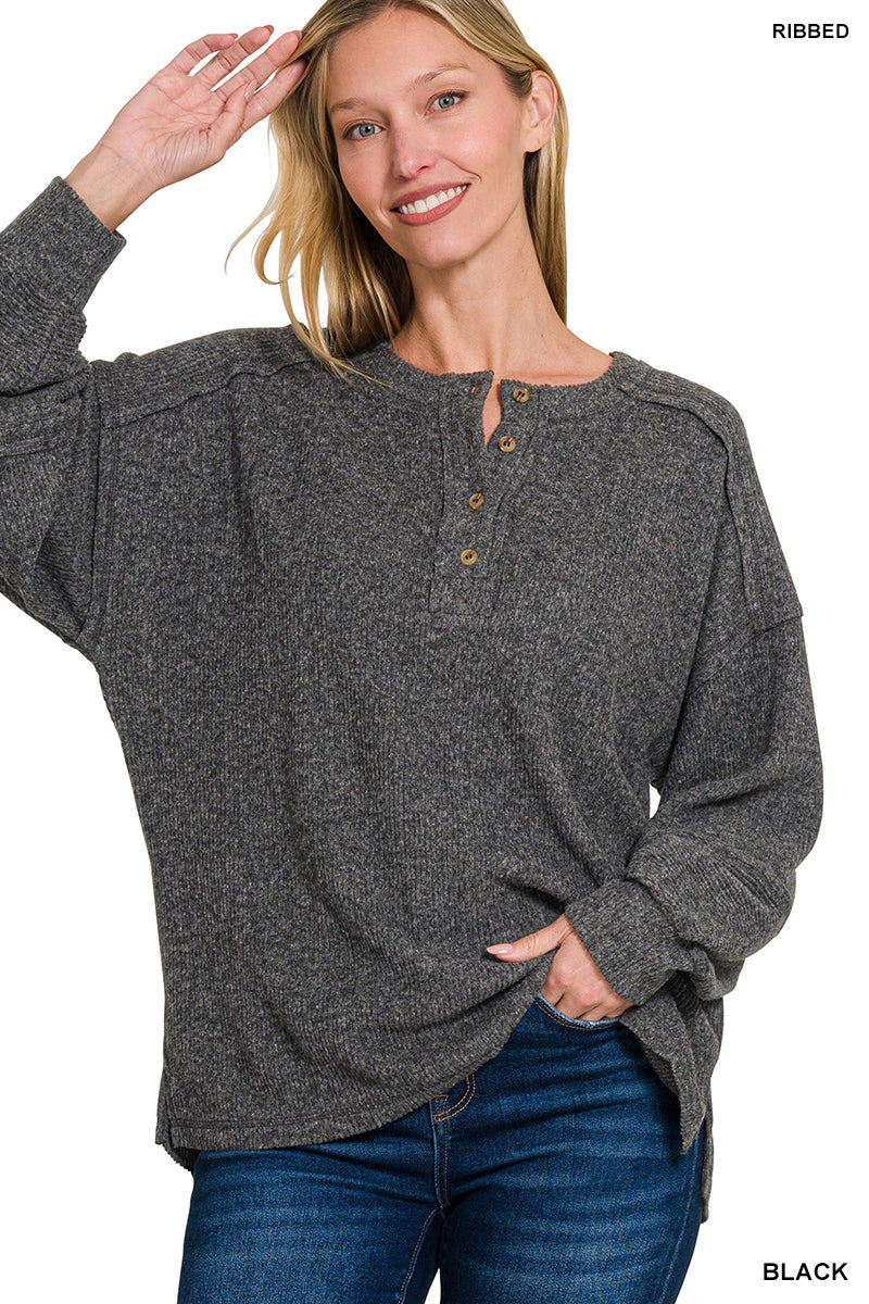 “Zenana Ribbed Brushed Melange Hacci Henley Sweater front view”
“Close-up of ribbed melange knit texture and Henley buttons”
“Sweater relaxed fit styled over jeans on model”