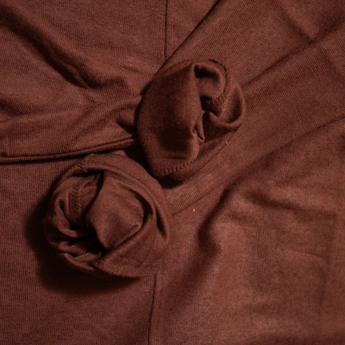 Close-up of brown fabric with a knot