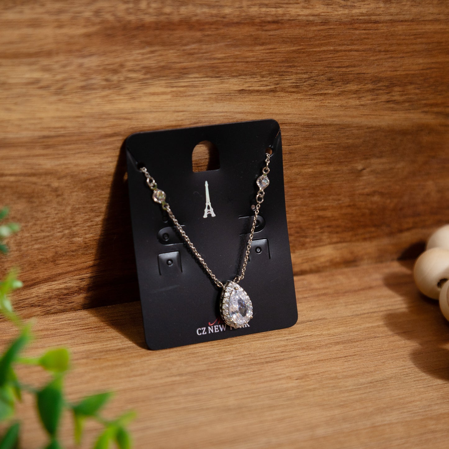 Glimmering Teardrop Halo Necklace