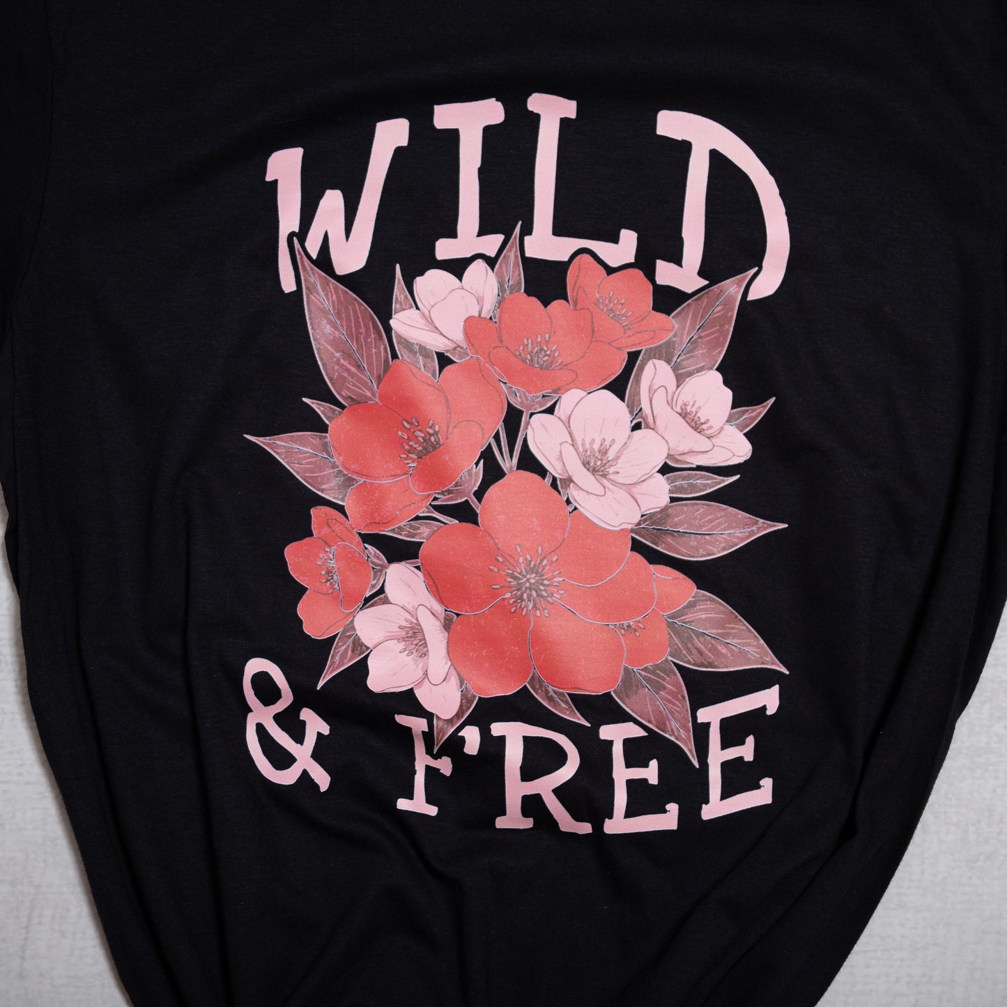 Wild & Free Floral Graphic Tee – Soft Black T-Shirt with Pink Flowers