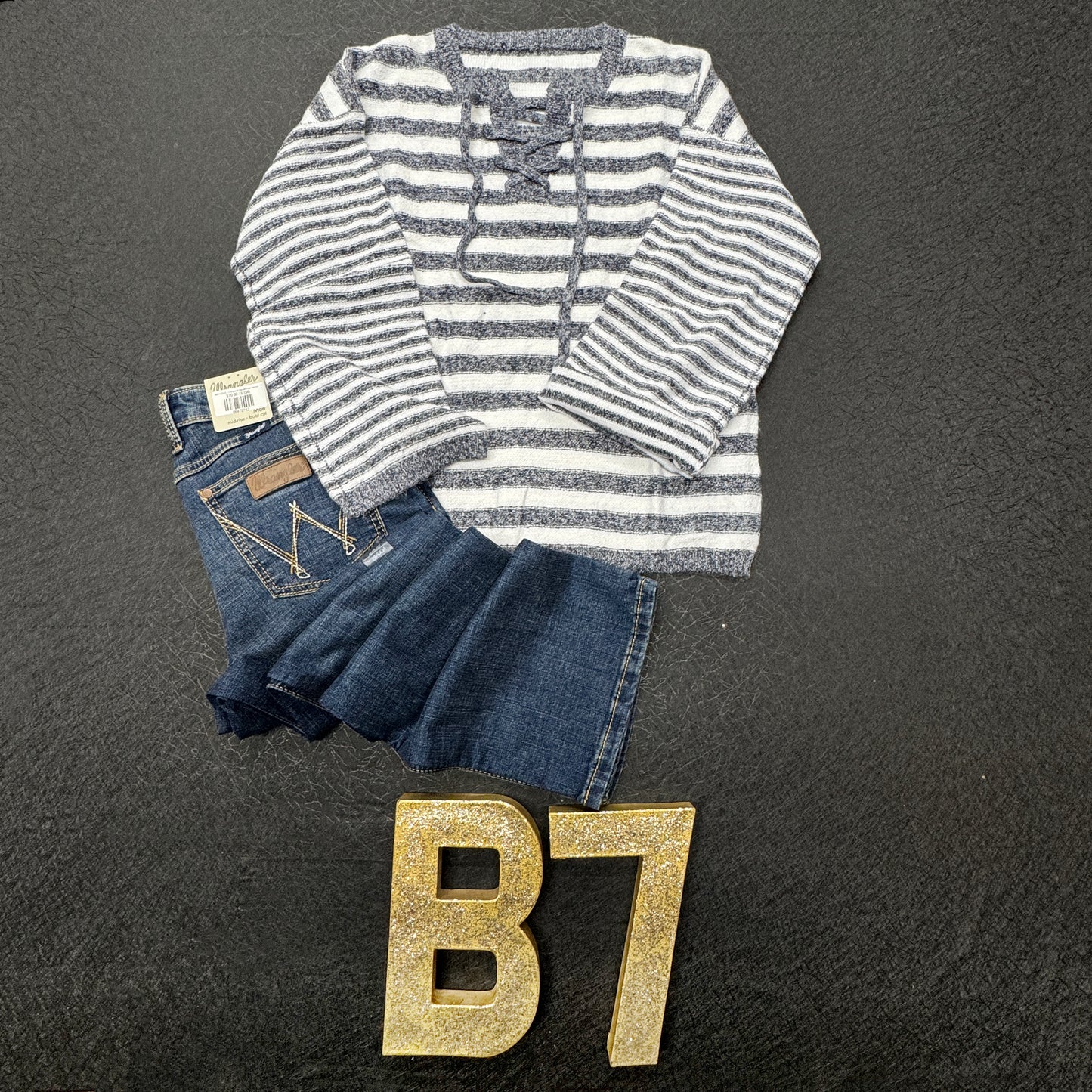 “Blue striped knit sweater with adjustable tie-back”
“Cozy blue and white striped sweater with back-tie detail”
“Lightweight long-sleeve tie-up sweater in blue stripes – B7 Boutique”