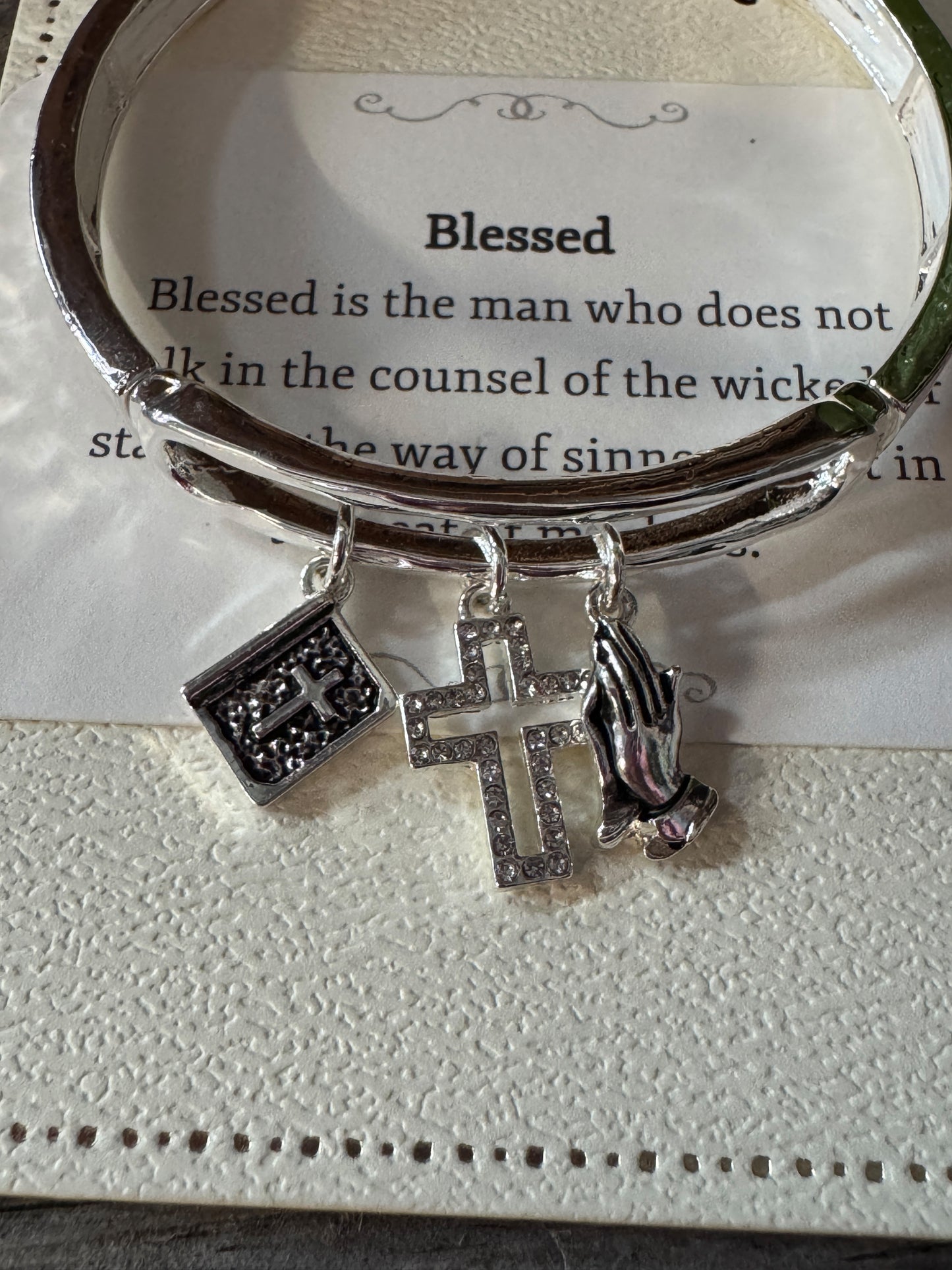 Faithful Grace silver charm bracelet with Bible, praying hands, and cross
Inspirational faith charm bracelet adjustable fit
Meaningful religious jewelry from B7 Boutique