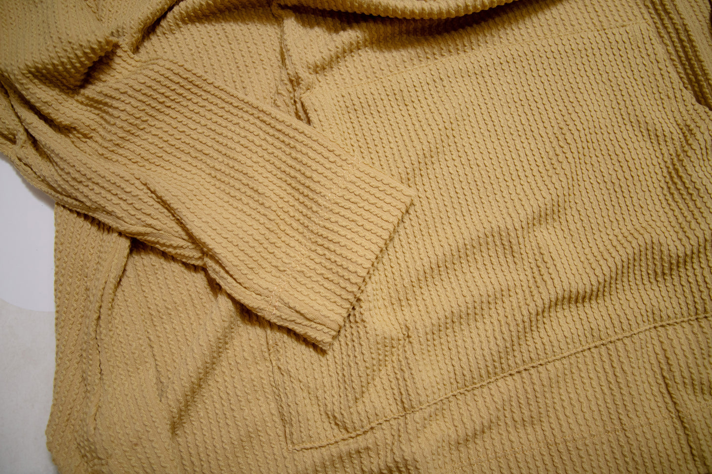 Flat Lay of Mustard Stay Cozy Soft Textured Hoodie by Stylive with Distressed Jeans and Boho Boutique Decor