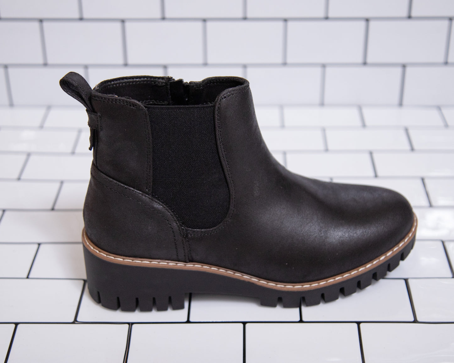 Women’s black ankle booties with lug sole and stretchy sides