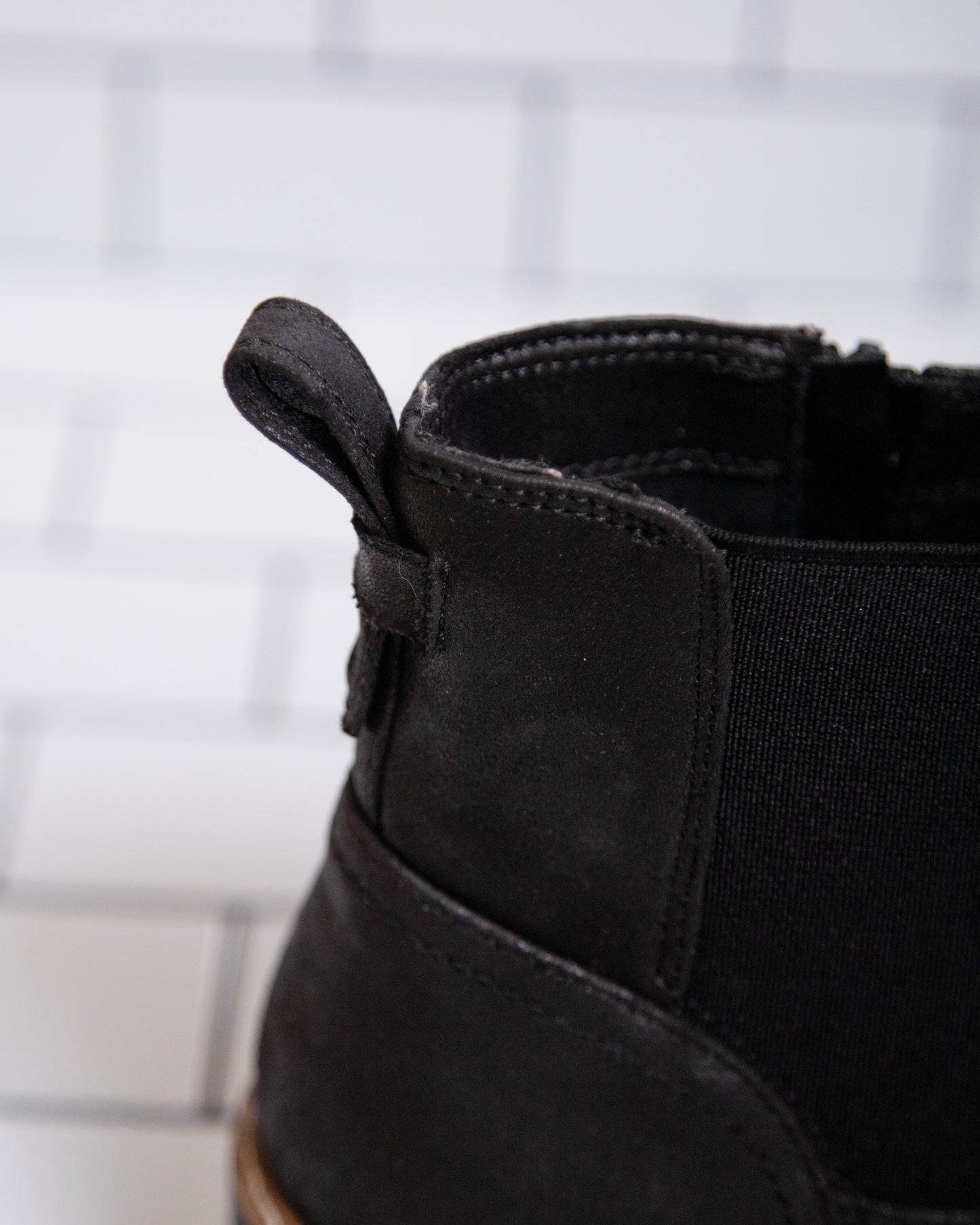 Women’s black ankle booties with lug sole and stretchy sides
