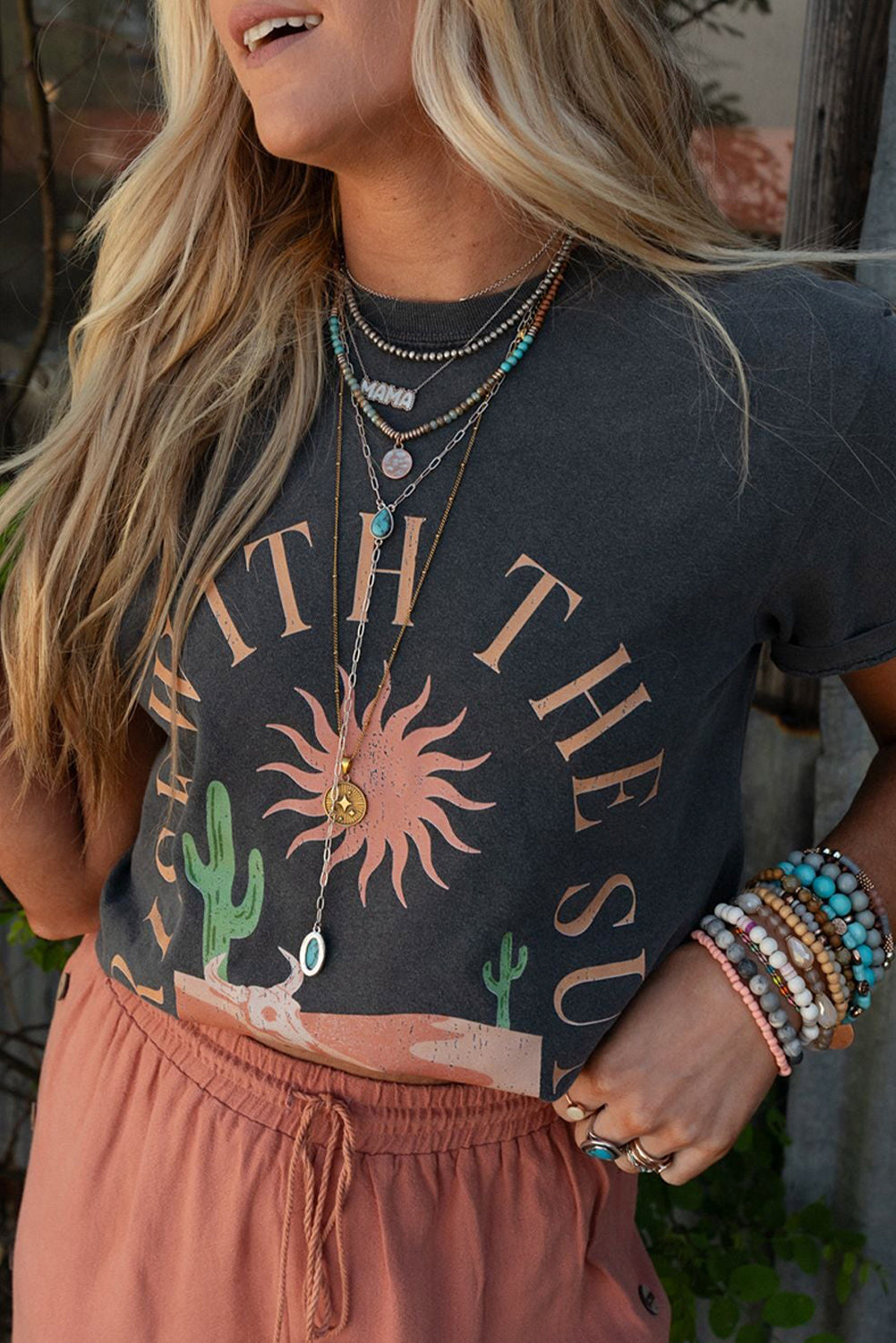 “Dark grey Rise With The Sun Western graphic tee with sunrise art”
“Western style graphic tee with sunburst design”
“Soft cotton blend sunrise tee for women”