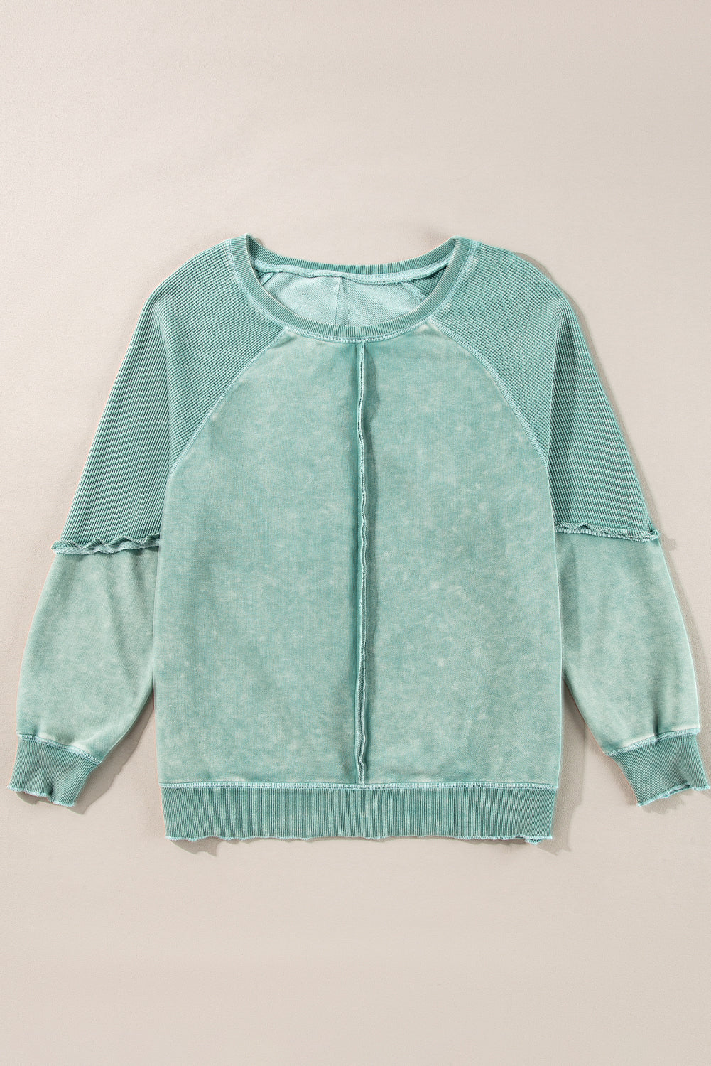 “Mineral blue waffle knit sweatshirt with patchwork raglan sleeves”
“Waffle texture sweatshirt with exposed seams – relaxed fit”
“Cozy patchwork raglan sleeve pullover in mineral blue”