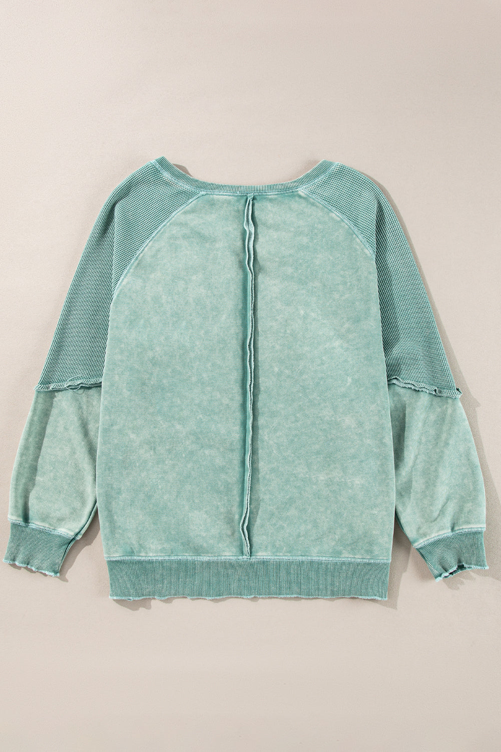 “Mineral blue waffle knit sweatshirt with patchwork raglan sleeves”
“Waffle texture sweatshirt with exposed seams – relaxed fit”
“Cozy patchwork raglan sleeve pullover in mineral blue”