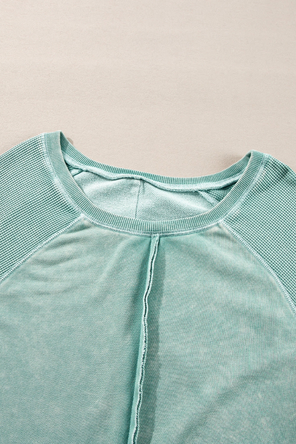 “Mineral blue waffle knit sweatshirt with patchwork raglan sleeves”
“Waffle texture sweatshirt with exposed seams – relaxed fit”
“Cozy patchwork raglan sleeve pullover in mineral blue”