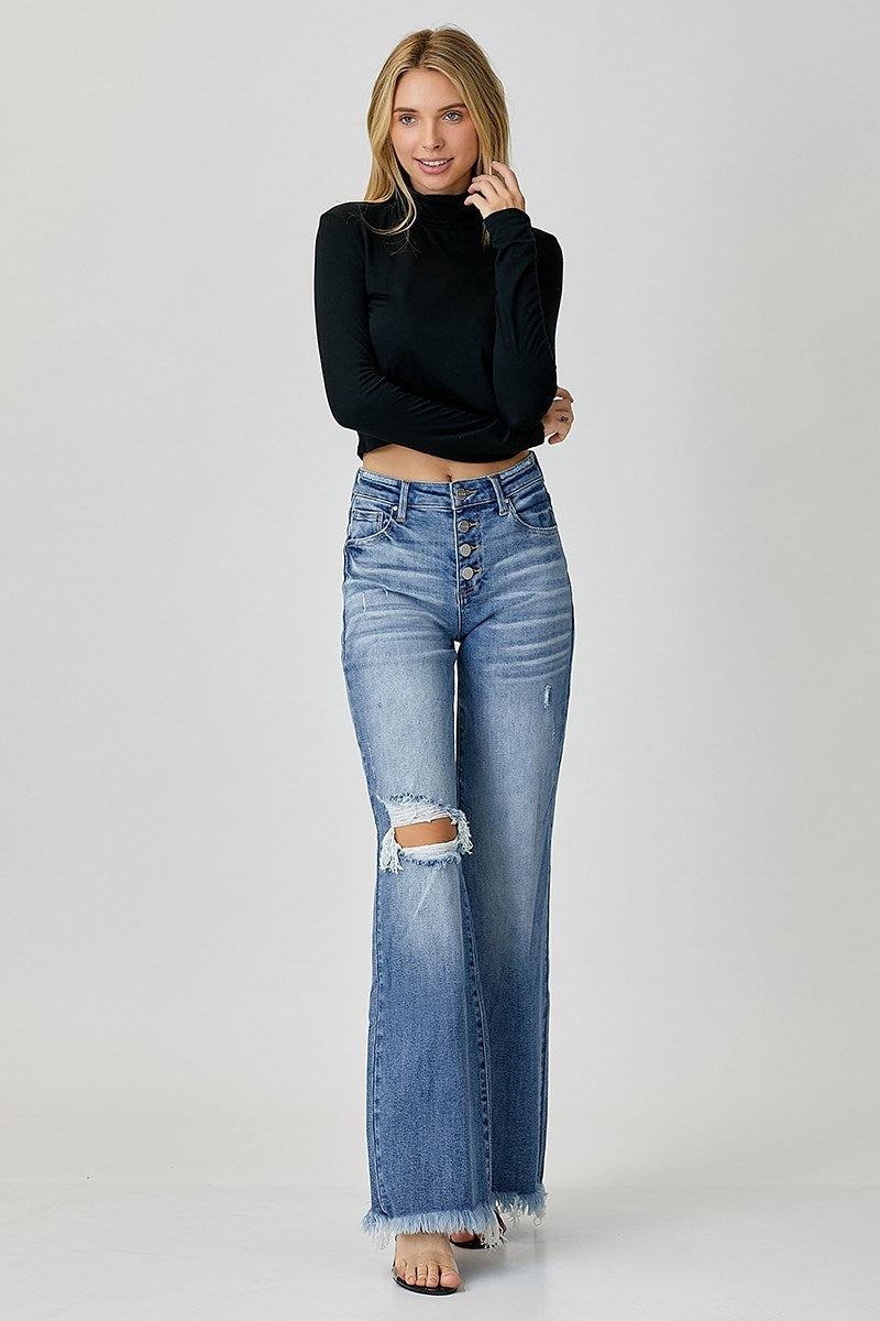 “Risen mid-rise wide leg jeans with button front closure”
“Stretch denim wide leg flare showing button fly detail”
“Wide-leg jeans styled with cropped top and boots”