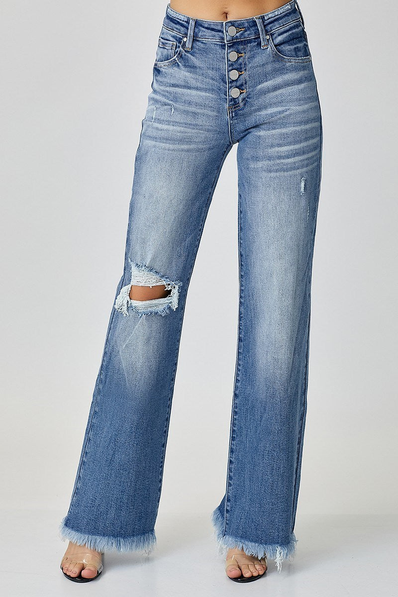 “Risen mid-rise wide leg jeans with button front closure”
“Stretch denim wide leg flare showing button fly detail”
“Wide-leg jeans styled with cropped top and boots”
