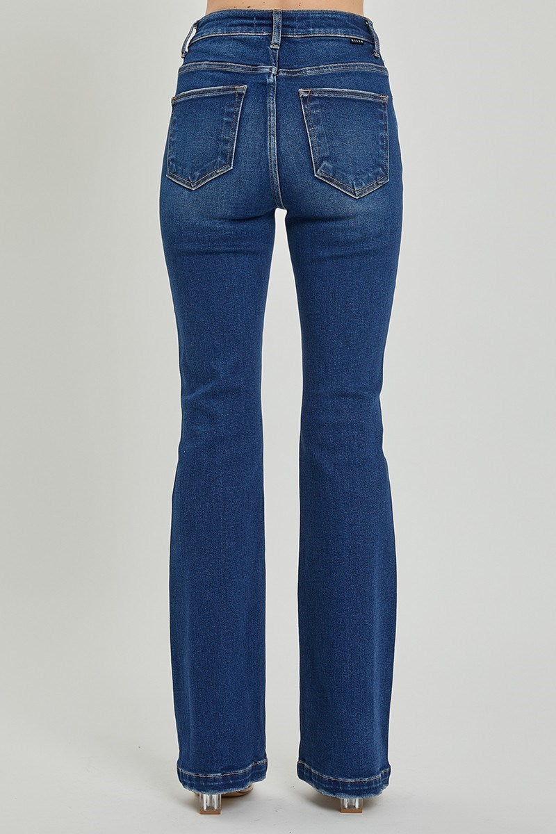 Front view of Risen high-rise bootcut jeans in light wash
Close-up of the button fly and denim texture
Back view showing flare leg and fit on model