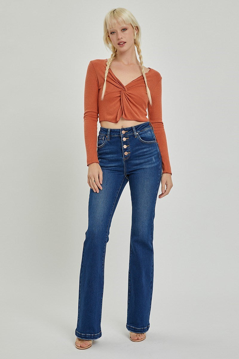 Front view of Risen high-rise bootcut jeans in light wash
Close-up of the button fly and denim texture
Back view showing flare leg and fit on model
