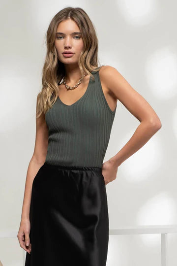 “Blu Pepper sleeveless V-neck sweater knit top for women”
“Lightweight knit top with V-neck and sleeveless cut”
“Relaxed sweater knit tank top in soft gauge fabric”