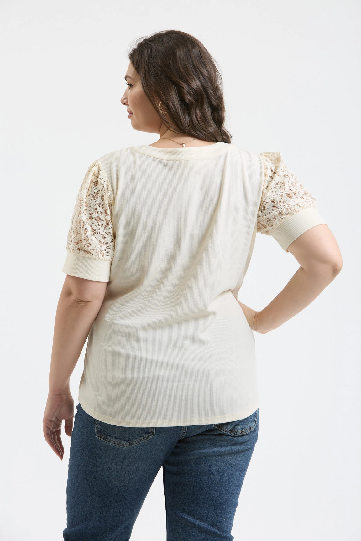 Blu Pepper plus size lace puff sleeve half-button knit top ivory
Close-up of lace puff sleeve and half-button detail
Plus size feminine knit top showing fit and sleeve texture