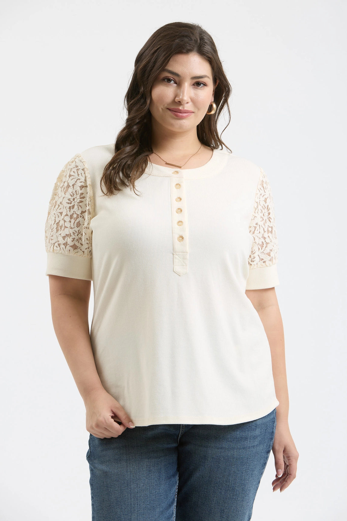 Blu Pepper plus size lace puff sleeve half-button knit top ivory
Close-up of lace puff sleeve and half-button detail
Plus size feminine knit top showing fit and sleeve texture