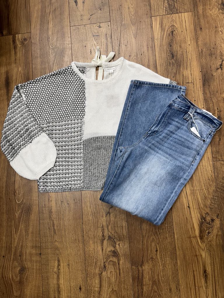 Grey multi-stripe colorblock crochet sheer knit sweater in open crochet with boat neck
Close-up of crochet knit texture and colorblock stripe pattern
Back view showing self-tie boat neckline detail
