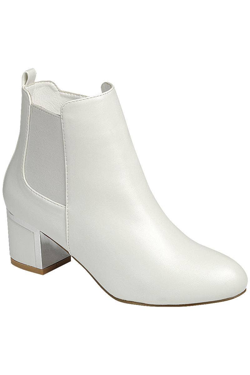 White ankle booties – front view
Side angle showing zipper and heel
Close-up of faux leather texture and stitching