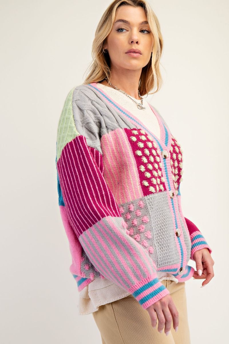 “Easel patchwork knit cardigan with colorful panels”
“Cozy patchwork beauty cardigan – relaxed fit and dropped shoulders”
“Button-front boho sweater with playful multicolor patchwork design”