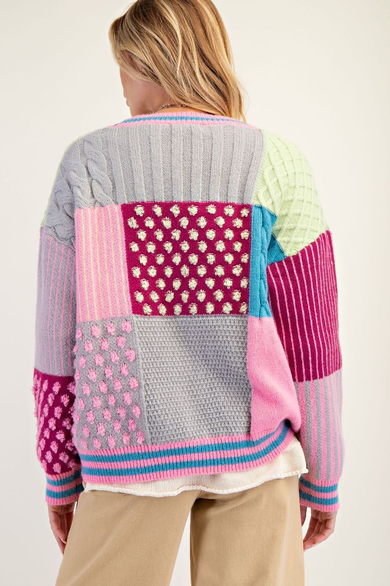 “Easel patchwork knit cardigan with colorful panels”
“Cozy patchwork beauty cardigan – relaxed fit and dropped shoulders”
“Button-front boho sweater with playful multicolor patchwork design”