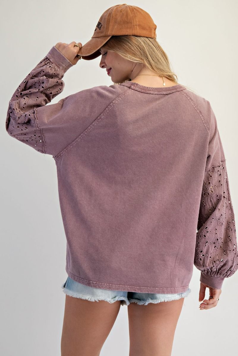 “Lightweight mineral-washed French terry pullover with eyelet lace raglan sleeves and crochet floral detail”
“Soft round-neck eyelet lace pullover top”
