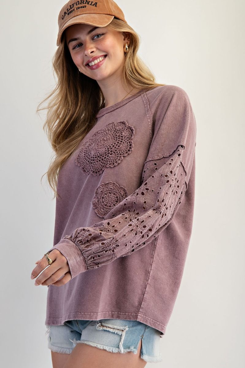 “Lightweight mineral-washed French terry pullover with eyelet lace raglan sleeves and crochet floral detail”
“Soft round-neck eyelet lace pullover top”