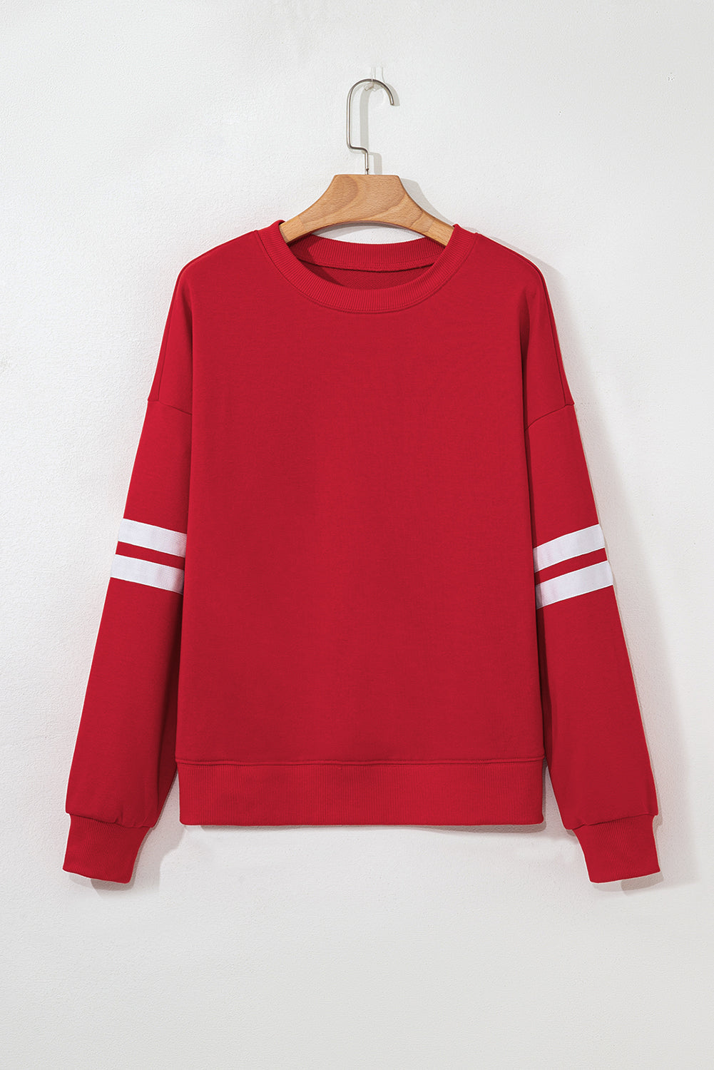 Fiery red oversized sweatshirt with varsity stripes
Drop-shoulder casual pullover in bright red
Bold red fleece sweatshirt for relaxed styling – B7 Boutique