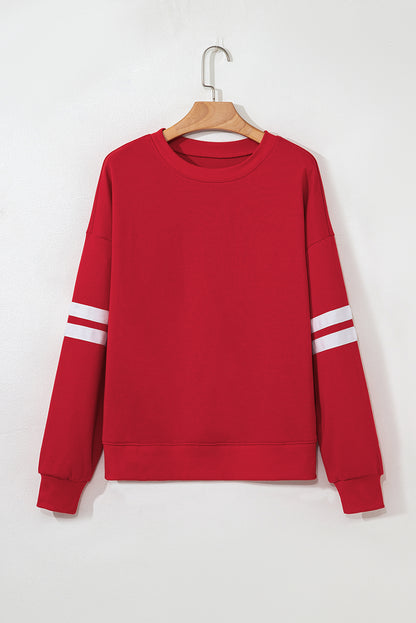 Fiery red oversized sweatshirt with varsity stripes
Drop-shoulder casual pullover in bright red
Bold red fleece sweatshirt for relaxed styling – B7 Boutique