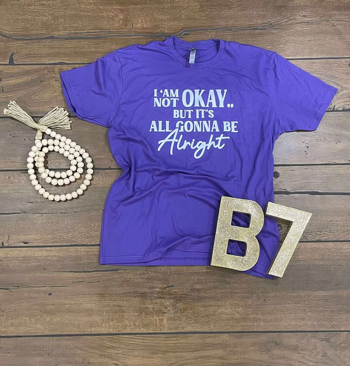 “I Am Not Okay But It’s All Gonna Be Alright” Graphic Tee – Uplifting & Relatable Everyday Comfort 🌤️