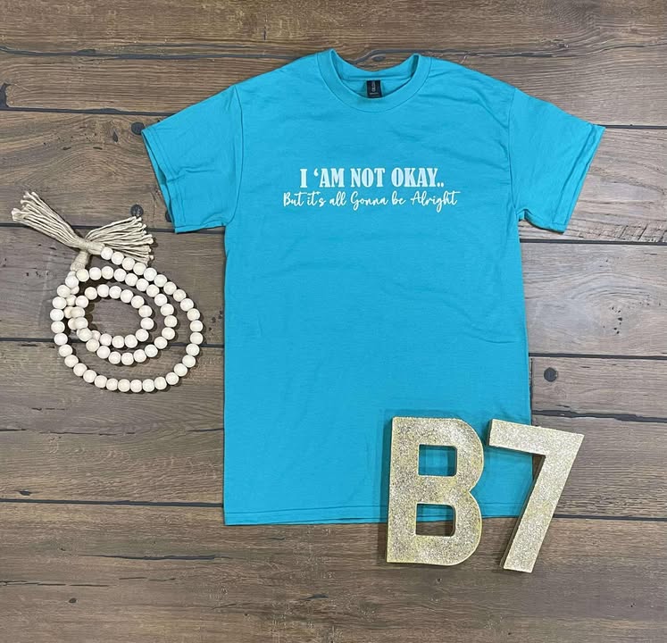 “I Am Not Okay But It’s All Gonna Be Alright” Graphic Tee – Uplifting & Relatable Everyday Comfort 🌤️
