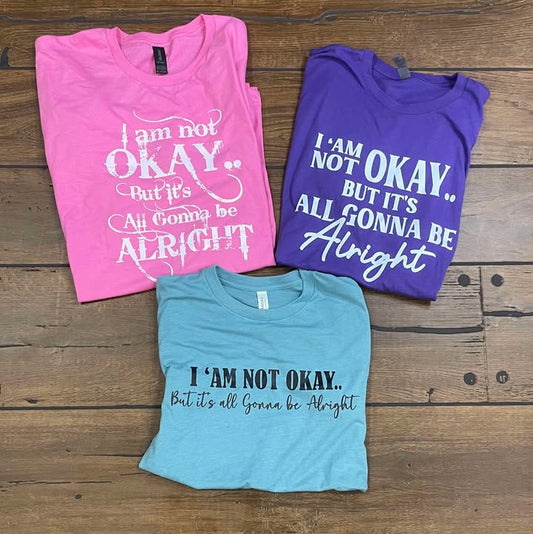 “I Am Not Okay But It’s All Gonna Be Alright” Graphic Tee – Uplifting & Relatable Everyday Comfort 🌤️