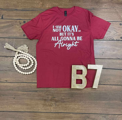 “I Am Not Okay But It’s All Gonna Be Alright” Graphic Tee – Uplifting & Relatable Everyday Comfort 🌤️