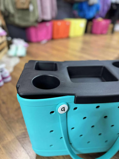 “Top o’ the Bogg To Ya topper tray in mushroom color sitting atop Original Bogg Bag”

“Tray view with built-in cup holders and tray within a tray design”

“Close-up of topper tray edges and EVA material texture”