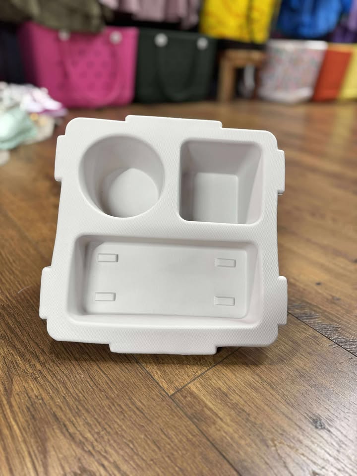 “Top o’ the Bogg To Ya topper tray in mushroom color sitting atop Original Bogg Bag”

“Tray view with built-in cup holders and tray within a tray design”

“Close-up of topper tray edges and EVA material texture”