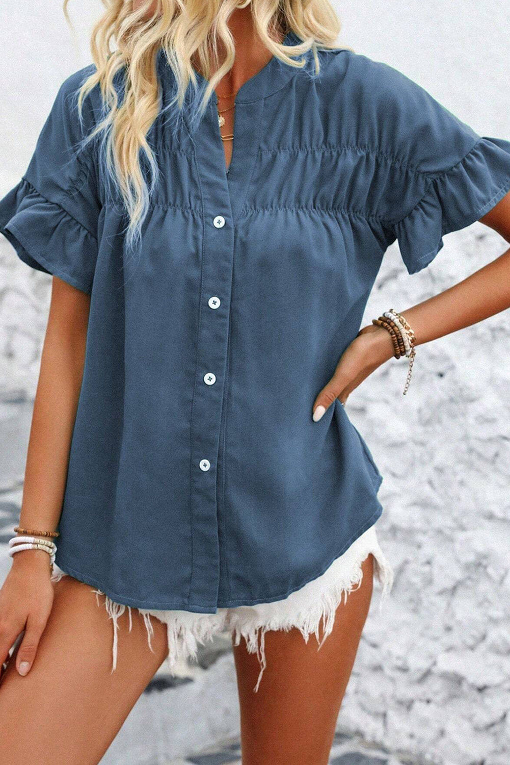 “Women’s solid ruffle sleeve ruched buttoned shirt”
“Ruffled short sleeve ruched shirt with buttons”
“Lightweight feminine button-up top with side ruching”