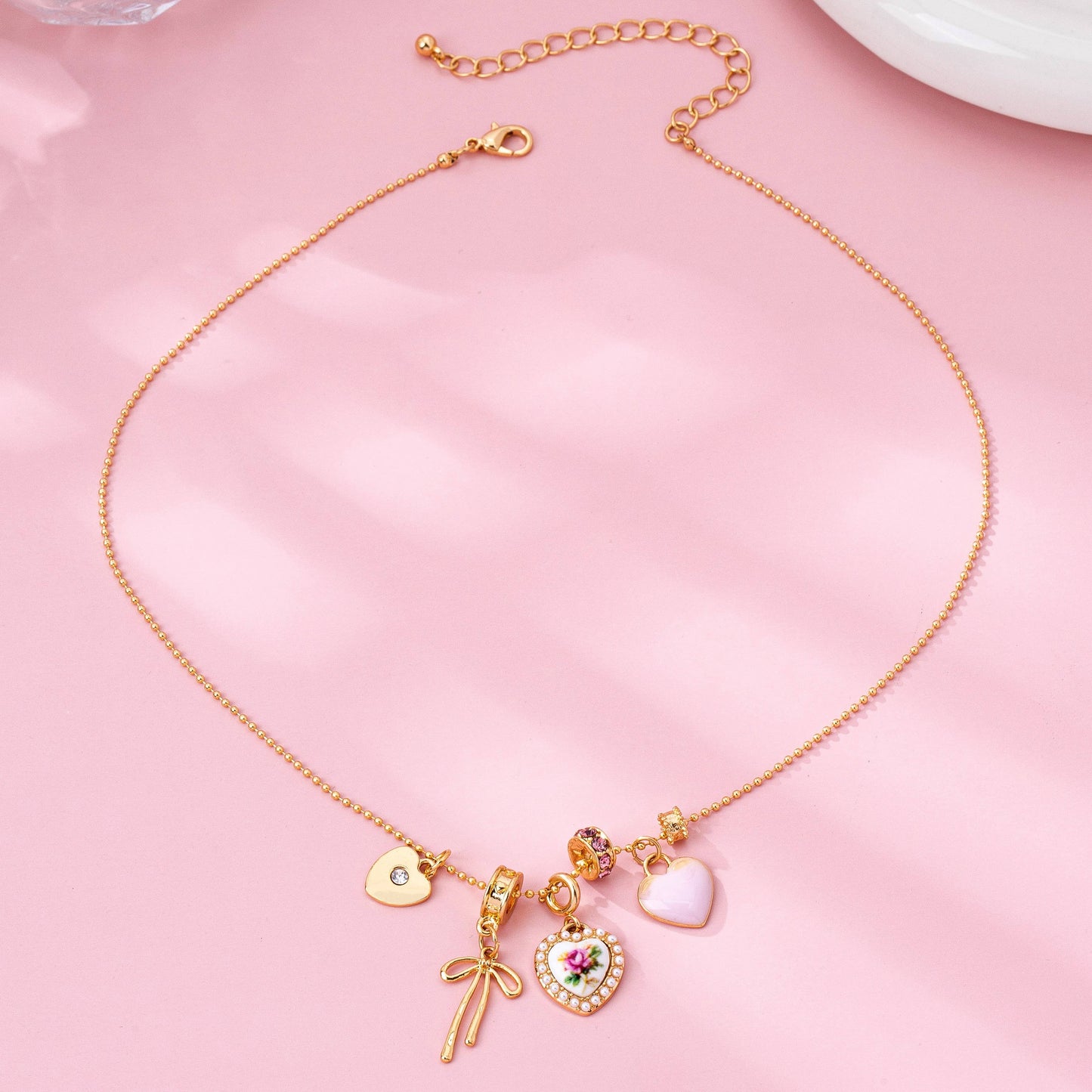 Rose Charm Cluster Necklace | Gold Plated Heart & Bow Necklace