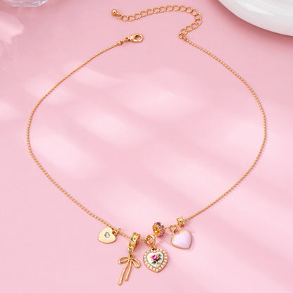 Rose Charm Cluster Necklace | Gold Plated Heart & Bow Necklace
