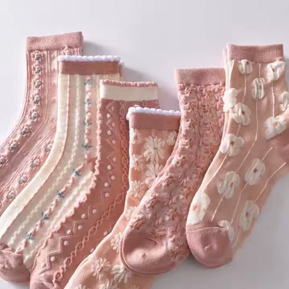 Boutique-style pink ruffle socks with flower frill