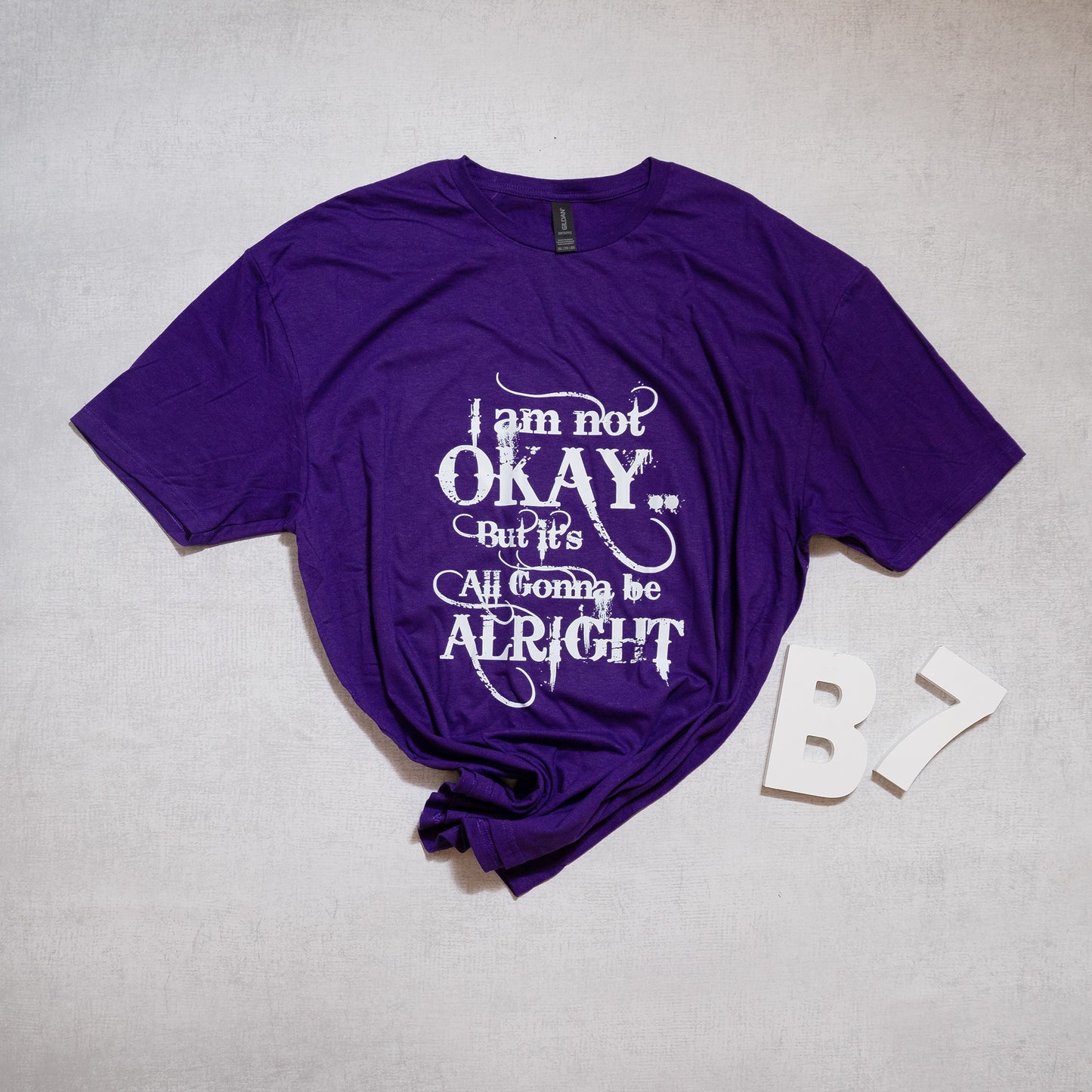 “I Am Not Okay But It’s All Gonna Be Alright” Graphic Tee – Uplifting & Relatable Everyday Comfort 🌤️